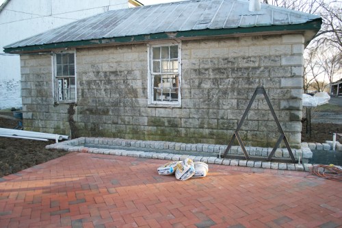 The brick paving throughout is artwork, but what I really can't wait to see is the water wheel that's going to be hinged on the iron frame built into the pond's coping.